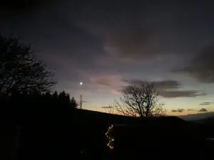 A gorgeous post sunset sky with venus off grid sustainable eco glampsite and glamping