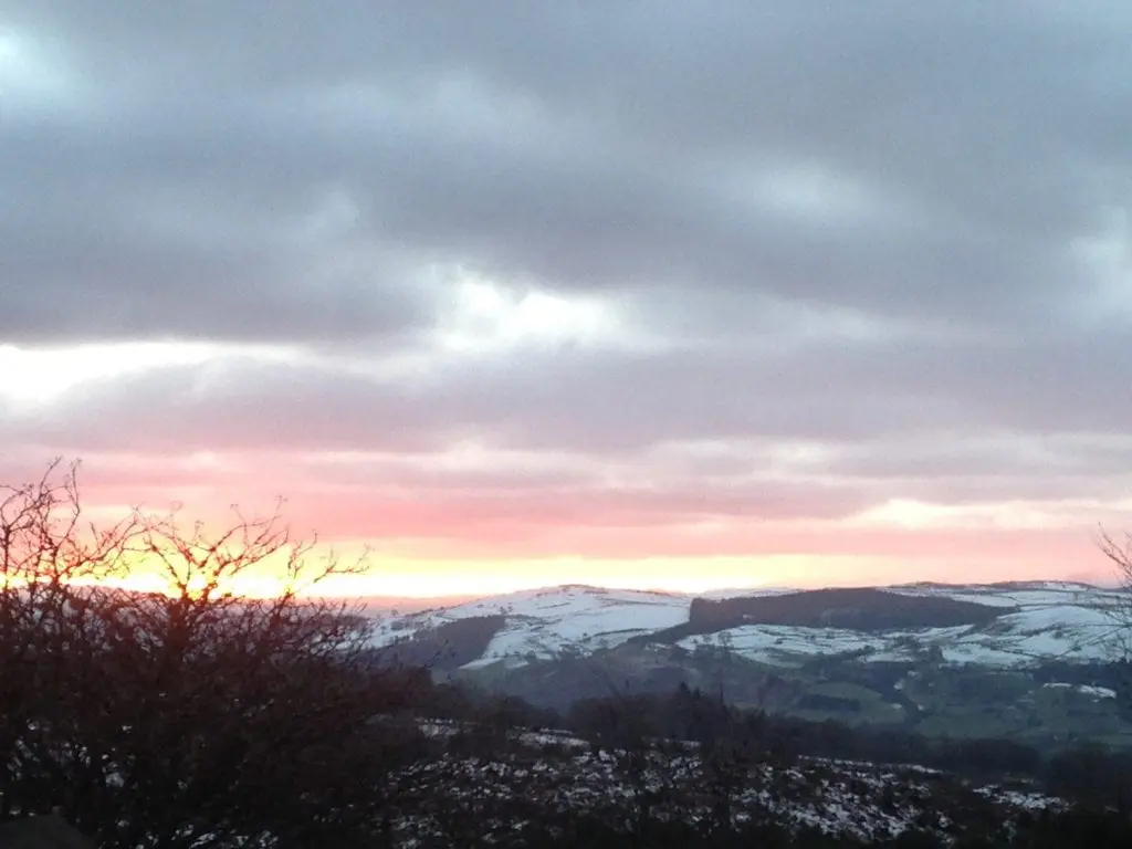 A wintry sunset off grid sustainable eco glampsite and glamping