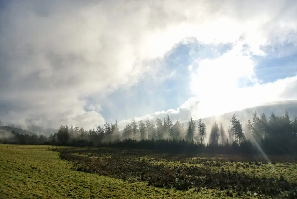 Morning sun over moel henfaes off grid sustainable eco glampsite and glamping