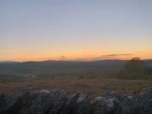 Snowdon and the dee valley after sunset from ty mam mawr off grid sustainable eco glampsite and glamping