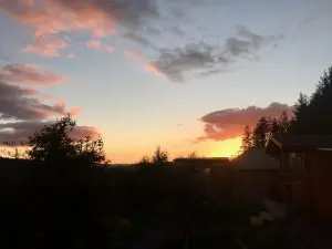 Sunset over ty crwn bach idris off grid sustainable eco glampsite and glamping