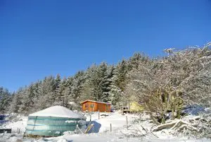 Ty crwn mawr yurt in the snow off grid sustainable eco glampsite and glamping