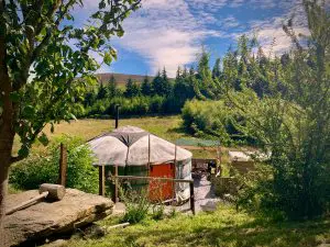 Ty crwn mawr yurt outside old cover 1 off grid sustainable eco glampsite and glamping