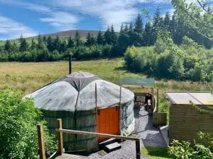 Ty crwn mawr yurt outside old cover 2 off grid sustainable eco glampsite and glamping
