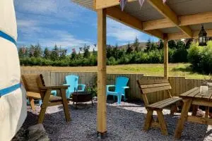 Ty crwn mawr yurt outside covered dining area and fire pit 3 off grid sustainable eco glampsite and glamping