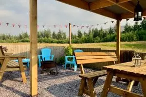 Ty crwn mawr yurt outside covered dining area and fire pit 4 off grid sustainable eco glampsite and glamping