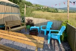 Ty crwn mawr yurt outside covered dining area and fire pit 8 off grid sustainable eco glampsite and glamping