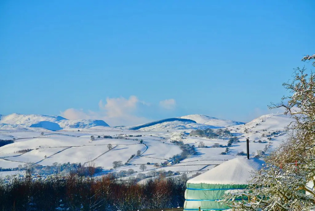 Ty crwn mawr yurt looking out to snowdonia in the winter off grid sustainable eco glampsite and glamping