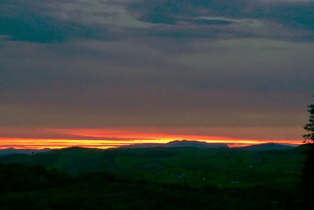 Sunset over arenig vawr off grid sustainable eco glampsite and glamping