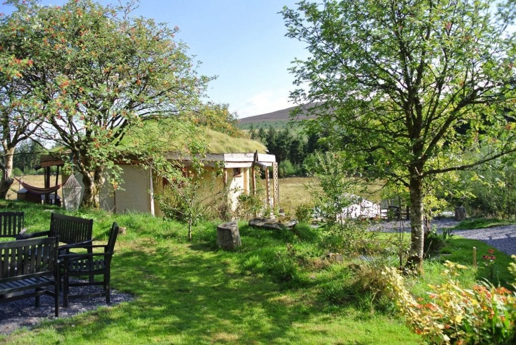 Fire pit and roundhouse at Ty Mam Mawr eco retreat centre