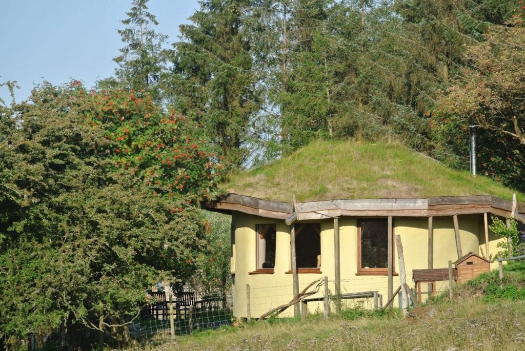 Here she is from the East in her new coat of paint! Ty Mam Mawr straw bale roundhouse