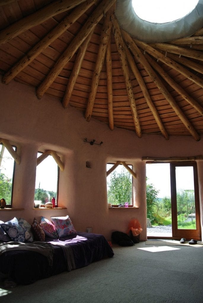 Inside Ty Mam Mawr straw bale roundhouse - the roof is a vortex to the higher realms...