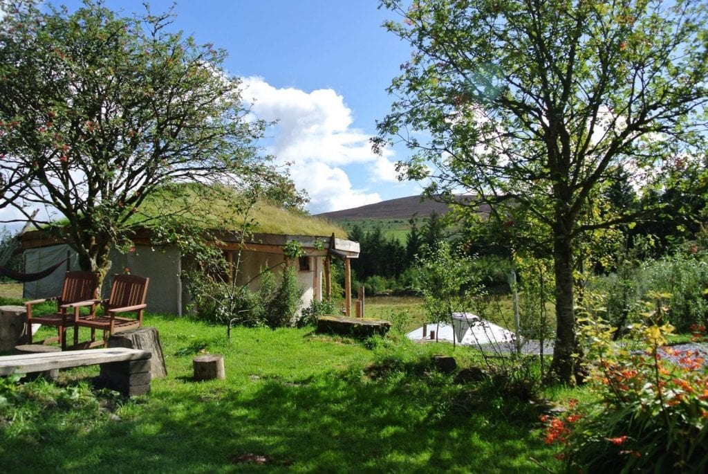 The straw bale roundhouse, Ty Crwn Mawr mongolian yurt, Moel y Henfaes and the central fire pit