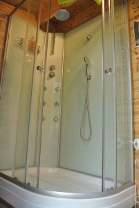 Log cabin bathroom super hot power shower off grid sustainable eco glampsite and glamping