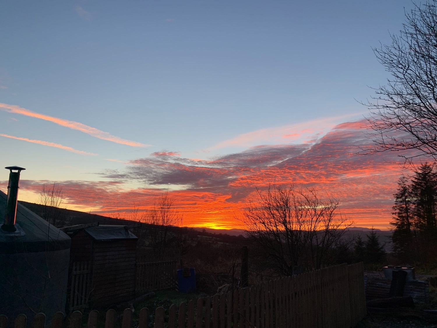 Sunset outside the small yurt off grid sustainable eco glampsite and glamping