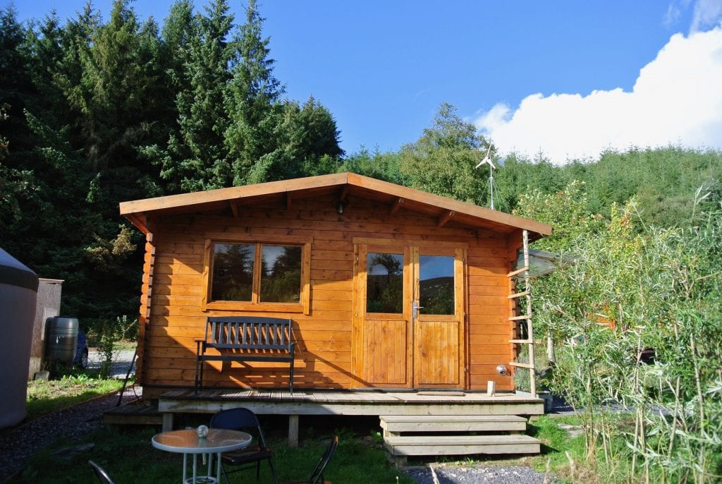 The log cabin kitchen and bathroom off grid sustainable eco glampsite and glamping