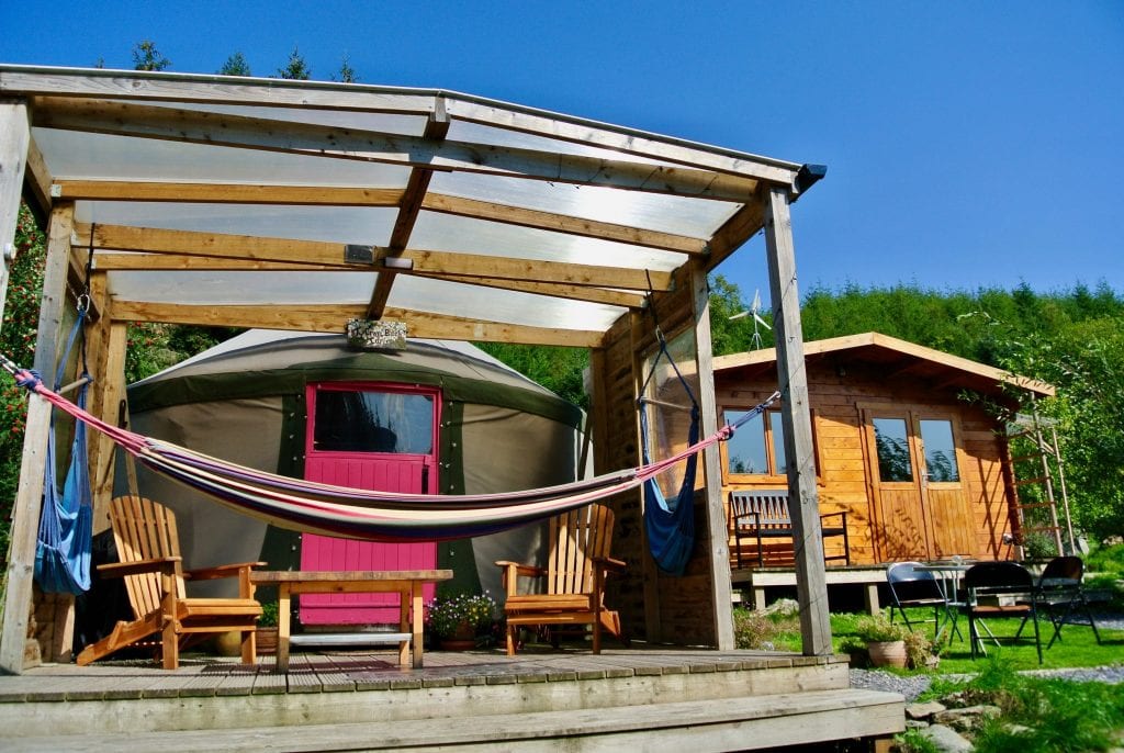 Ty Crwn Bach Idris Yurt - Covered deck with seats and hammocks - Off Grid Sustainable Eco Glampsite And Glamping