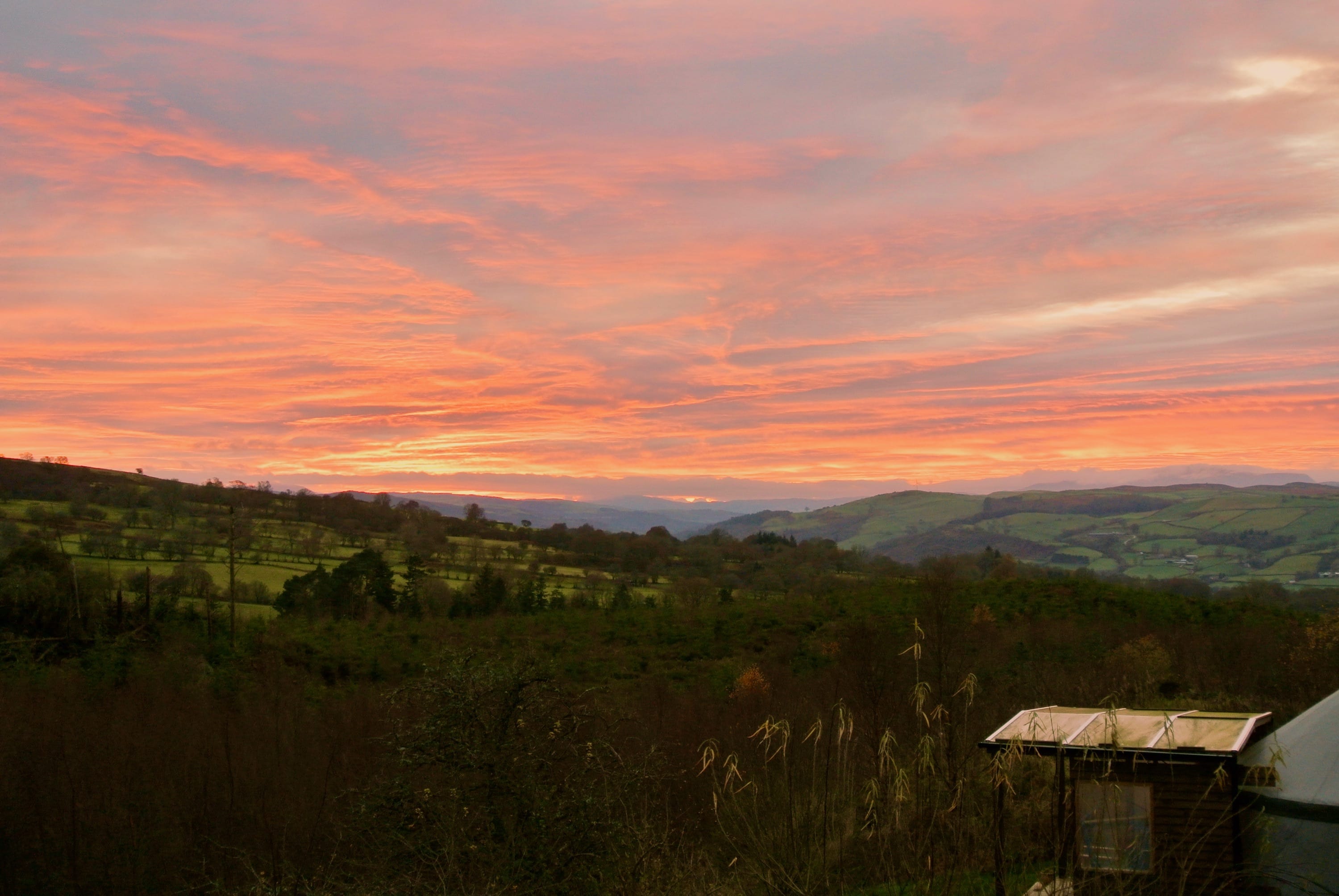 Ty crwn bach idris yurt red evening sky 1 off grid sustainable eco glampsite and glamping